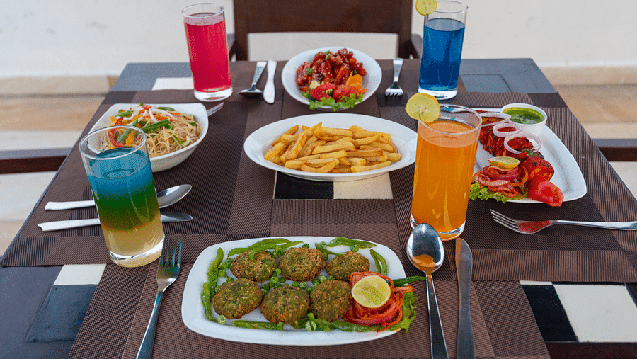 Table set with a variety of starters and refreshing beverages at DLS The Classio